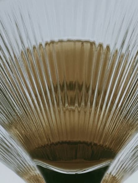 A fluted amber glass fan
