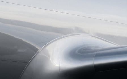 A steel grey curved surface