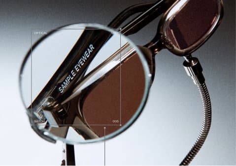 Tinted sunglasses seen through a magnifying lens, in warm brown.